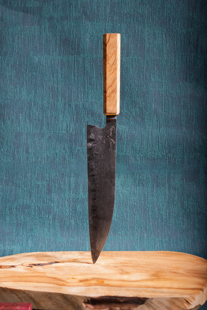 80CrV2 core with damast cladding and olive wood handle